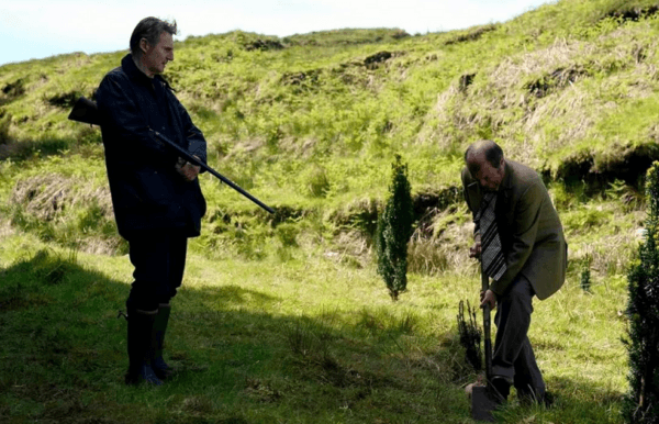 Finbar Murphy (Liam Neeson, L) makes Bart McGuiness (Mark O’Regan) dig his own grave, in "In the Land of Saints and Sinners." (Prodigal Films Limited)