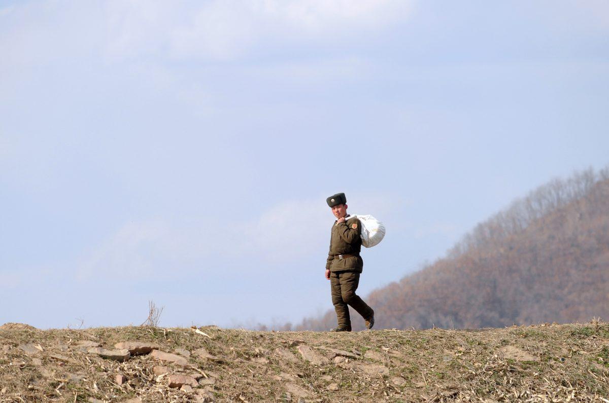 A North Korean soldier walks on the banks of the Yalu River at the North Korean town of Sinuiju across from the Chinese city of Dandong, in northeastern China's Liaoning Province on April 10, 2013. (Wang Zhao/AFP/Getty Images)