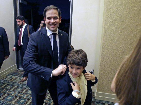 Sen. Marco Rubio, R-Fla., arrives with members of his family to a primary election party in Kissimmee, Fla., on Aug. 30, 2016. (AP Photo/John Raoux)