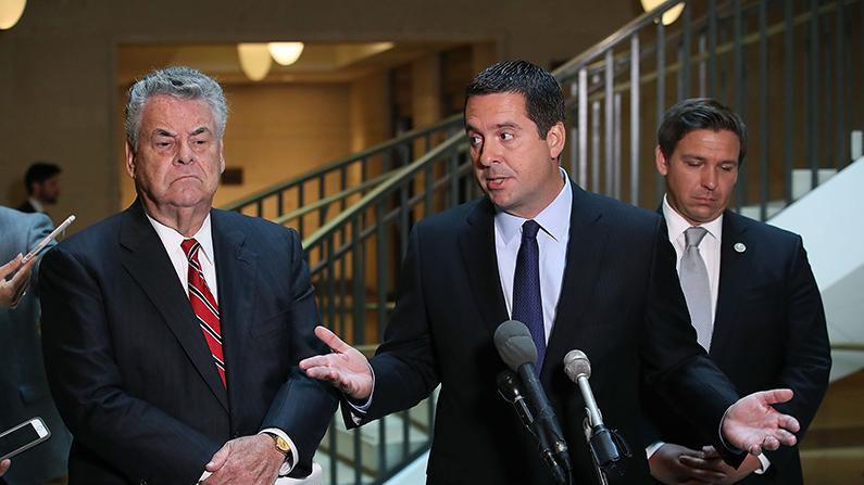 House Intelligence Committee Chairman Devin Nunes (R-CA)(C) stands with Rep. Peter King (R-NY), (L) and Rep. Don DeSantis (R-FL) as he announces that his committee and the House oversight committee are starting the investigation into Russia and Obama Administration uranium deal. (Mark Wilson/Getty Images)