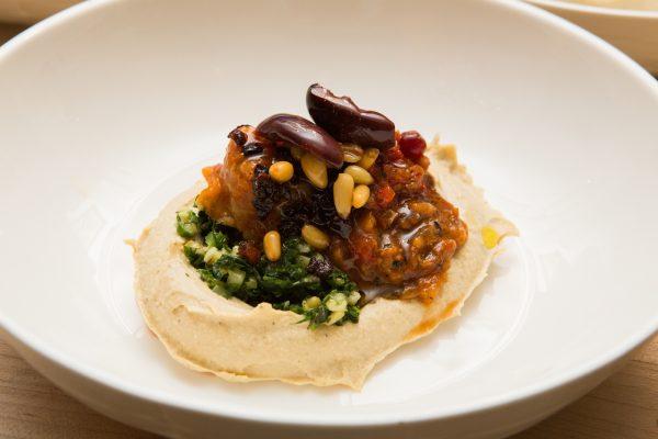 Middle Eastern flavors are popular. (Above) Chef Cassie Piuma's Seven-Layer Hummus, prepared for a James Beard House dinner in New York. (Jeffrey Gurwin)