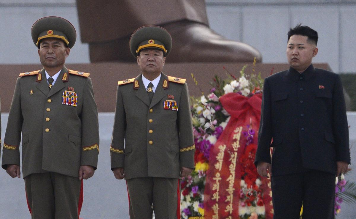 (FILES) This file photo taken on April 13, 2012 shows North Korean leader Kim Jong-Un (R) attending the unveiling ceremony of two statues of former leaders Kim Il-Sung and Kim Jong-Il in Pyongyang. (PEDRO UGARTE/AFP/GettyImages)