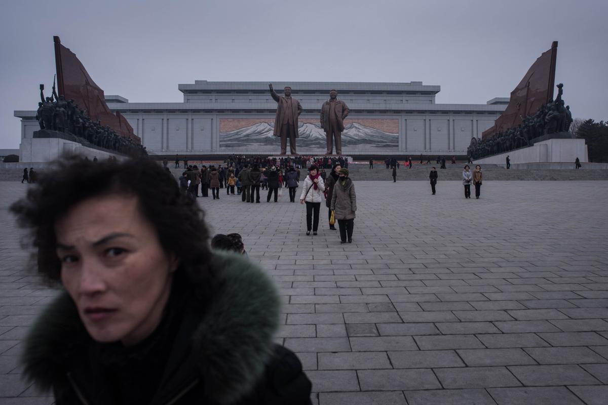 People visit the statues of late North Korean leaders Kim Il-Sung and Kim Jong-Il to pay their respects on the occasion of the 75th anniversary of the birth of Kim Jong-Il, at Mansudae Hill in Pyongyang on Feb. 16, 2017. North Korea marks Kim Jong-Il's Feb. 16 birthday as the "Day of the Shining Star." (ED JONES/AFP/Getty Images)