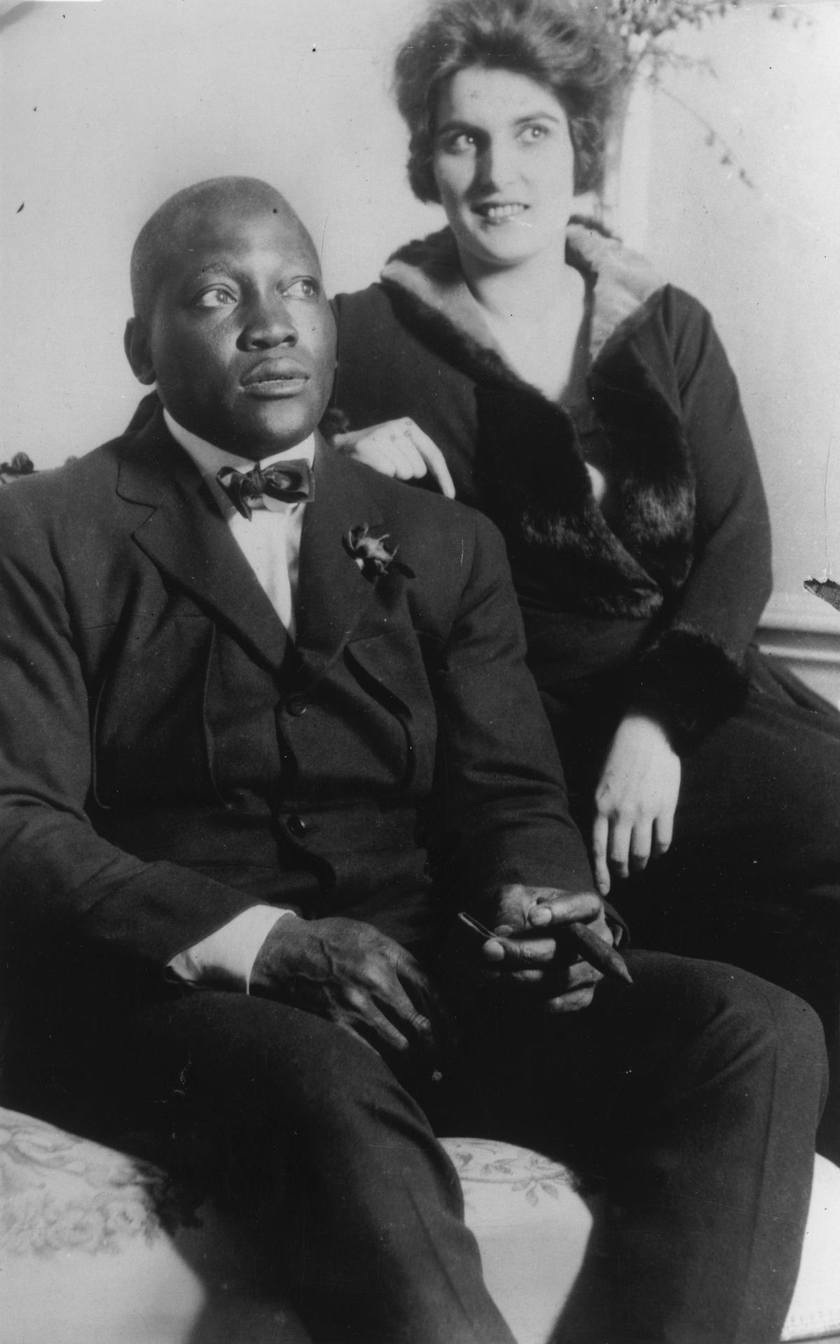 15th February 1924: American boxer, Jack Johnson (1878-1946) with his wife. (Topical Press Agency/Getty Images)