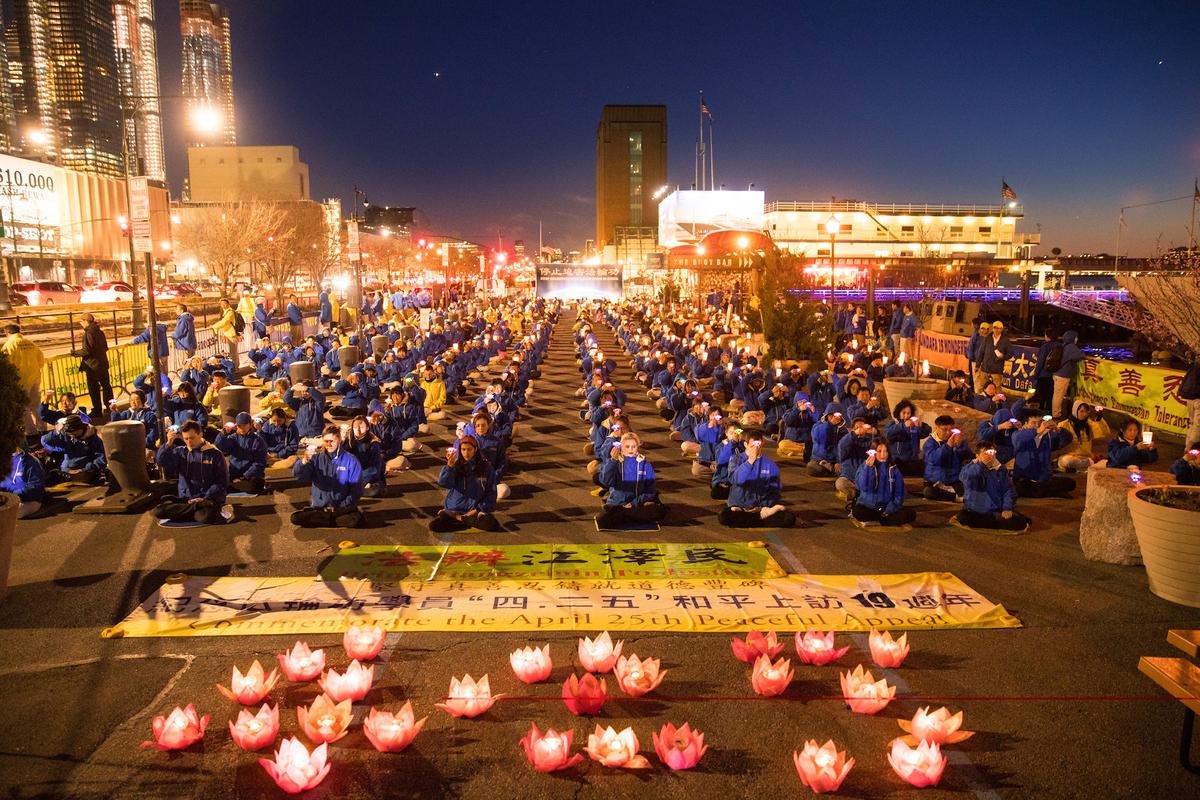 Falun Gong practitioners at a candlelight vigil near the Chinese consulate in New York City, on April 22, 2018. (Mark Zou/The Epoch Times)