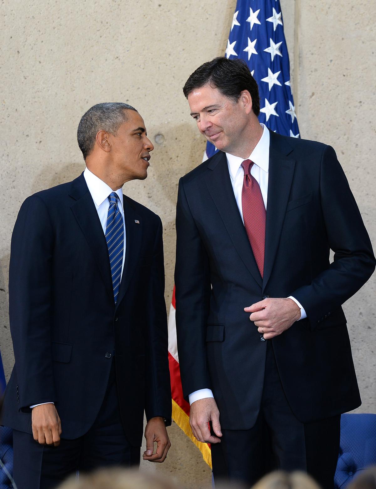 President Barack Obama (L) talks with new Federal Bureau of Investigation (FBI) director James Comey during his installation ceremony at the FBI headquarters in Washington on October 28, 2013. (JEWEL SAMAD/AFP/Getty Images)