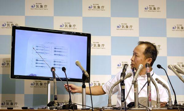 Japan's meteorological agency officer Toshiyuki Matsumori displays a chart showing seismic activity following North Korea's nuclear test, during a press conference at the agency's headquarters in Tokyo, Japan, on September 3, 2017.(Kazuhiro Nogi/AFP/Getty Images)