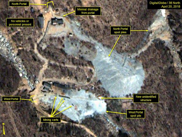 PUNGGYE-RI NUCLEAR TEST SITE, NORTH KOREA - APRIL 20, 2018. A train of mining carts and new structure are present at the West Portal spoil pile. (DigitalGlobe/38 North via Getty Images)
