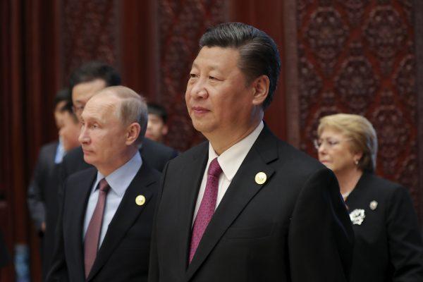 Chinese leader Xi Jinping and Russia's President Vladimir Putin (L) attend a summit for the One Belt, One Road initiative, at the International Conference Center in Yanqi Lake, north of Beijing, on May 15, 2017. (Lintao Zhang/AFP/Getty Images)