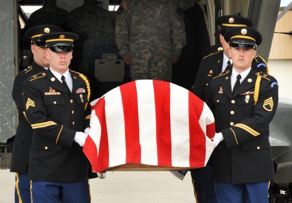 The South Dakota Army National Guard Military Funeral Honors Team transfers the remains of Sgt. 1st Class Arthur F. Jewett at Rapid City Regional Airport, S.D., Sept. 22, 2009. (U.S. Army photo by Sgt. Lance Alan Schroeder)