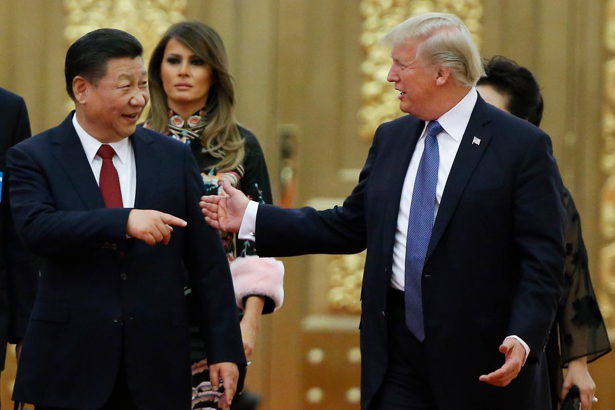 President Donald Trump and China's President Xi Jinping arrive at a state dinner at the Great Hall of the People on Nov. 9, 2017, in Beijing, China. (Thomas Peter - Pool/Getty Images)
