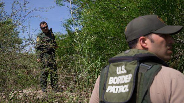 Border Patrol agents search the Rio Grande River for illegal immigrants crossing the border from Mexico into the United States near McAllen, Texas, on March 26, 2018. (Loren Elliott/AFP/Getty Images)