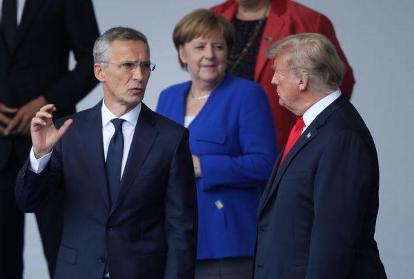 NATO Secretary General Jens Stoltenberg (L), German Chancellor Angela Merkel, and President Donald Trump attend the opening ceremony of the NATO Summit at the NATO headquarters in Brussels, Belgium on July 11, 2018. (Sean Gallup/Getty Images)
