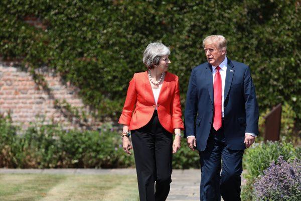 Prime Minister Theresa May walks with President Donald Trump at Chequers in Aylesbury, England, on July 13, 2018. (Jack Taylor/Getty Images)