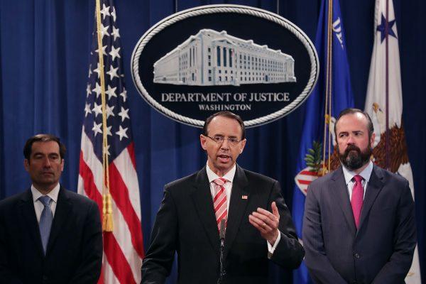 Deputy Attorney General Rod Rosenstein (C), Acting Principal Associate Deputy Attorney General Edward O'Callaghan (R), and Assistant Attorney General John Demers hold a news conference at the Department of Justice in Washington on July 13, 2018..(Chip Somodevilla/Getty Images)