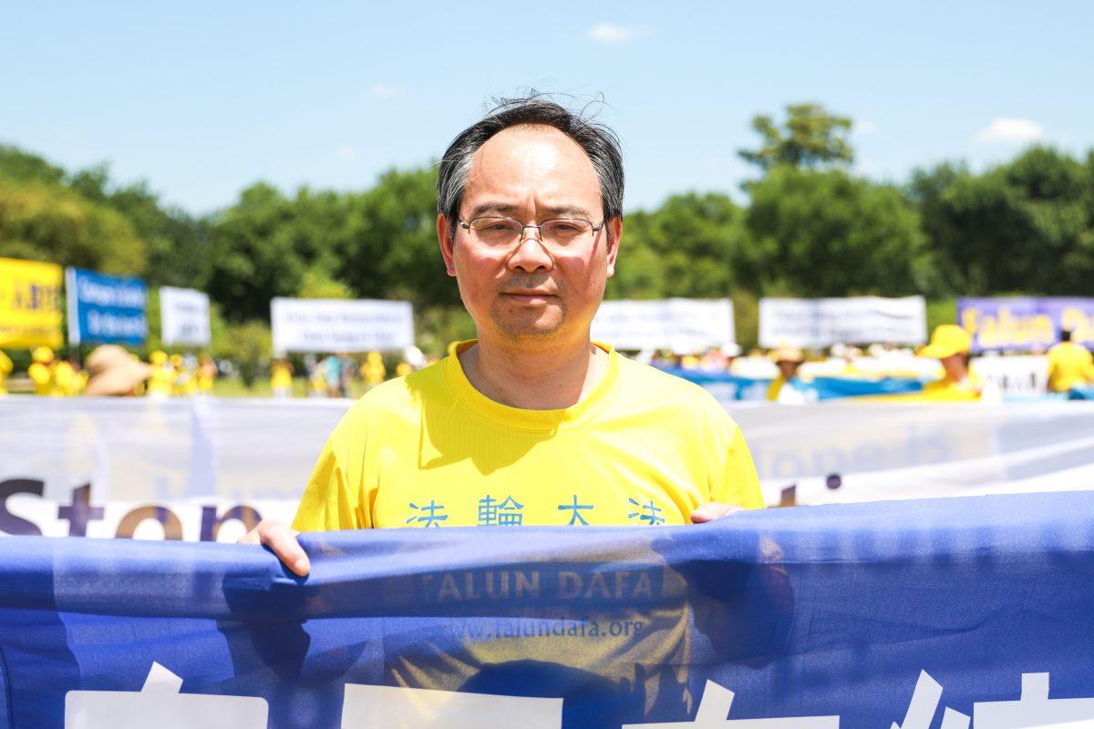 Xueye Zhu takes part in the 19th anniversary of the beginning of the persecution of Falun Gong on July 20,1999, at the Washington Monument in Washington on July 19, 2018. (Samira Bouaou/The Epoch Times)