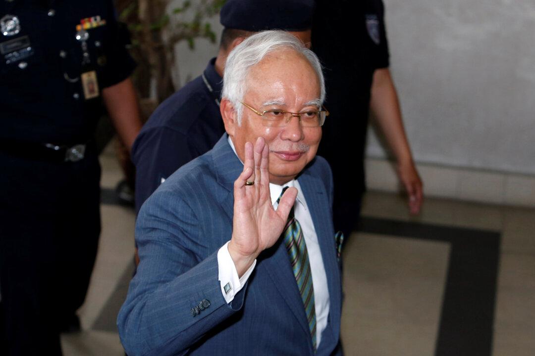 Former Malaysian Prime Minister Leads Party to Landslide Victory in State Elections
