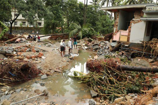 Indian residents look at houses destroyed by flood waters at Kannappankundu in Kozhikode, in the Indian state of Kerala on Aug. 10, 2018. (AFP/Getty Images)