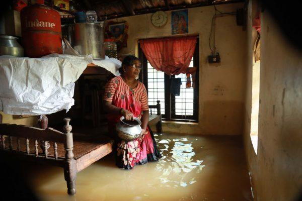 An Indian woman sits inside her houses immersed in flood waters in Ernakulam district of Kochi, in the Indian state of Kerala on Aug. 10, 2018. (AFP/Getty Images)