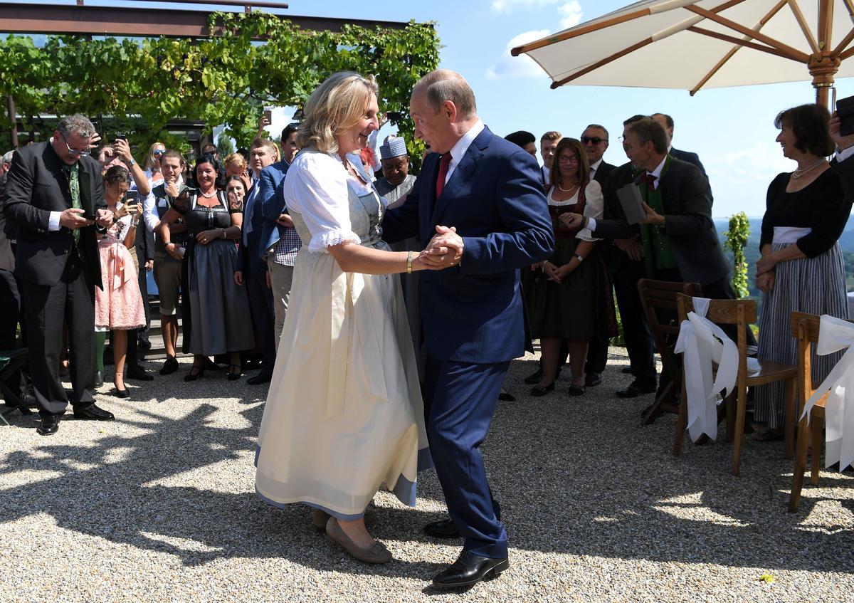 Austria's Foreign Minister Karin Kneissl dances with Russia's President Vladimir Putin at her wedding in Gamlitz, Austria on August 18, 2018. (Roland Schlager/Pool)