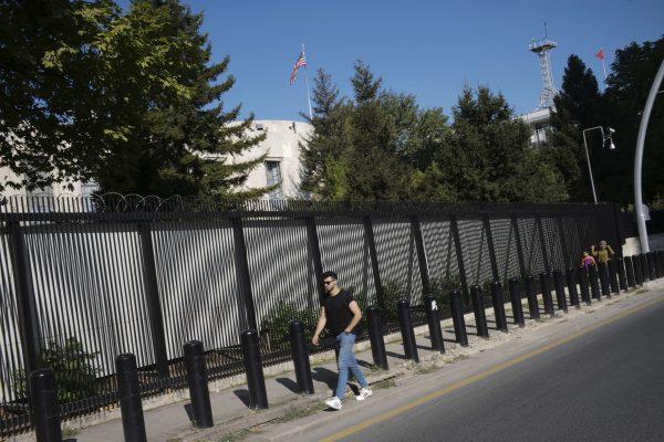 People walk outside the U.S. Embassy in Ankara, Turkey on Aug. 20, 2018. (AP Photo/Burhan Ozbilici)