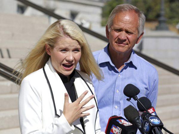 Elizabeth Smart speaks during a news conference while her father Ed Smart looks on Thursday, Sept. 13, 2018.(AP Photo/Rick Bowmer)
