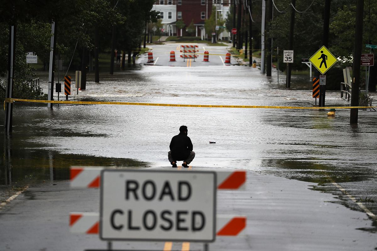A road is washed out by the rains from Hurricane Florence as it passed through Fayetteville, North Carolina, Sept. 16, 2018. (Joe Raedle/Getty Images)