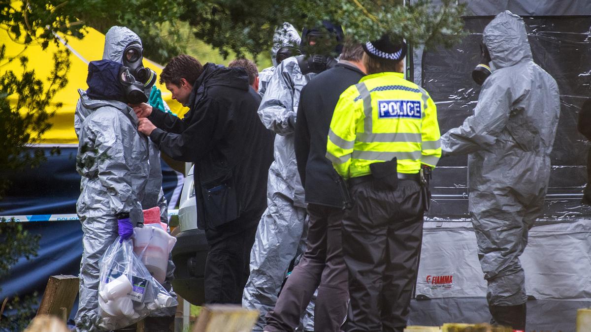 Police officers wear protective suits and breathing apparatus in London Road cemetery as they continue investigations into the poisoning of Sergei Skripal who was found critically ill on a bench in Salisbury on March 10, 2018, in Salisbury, England. (Chris J Ratcliffe/Getty Images)