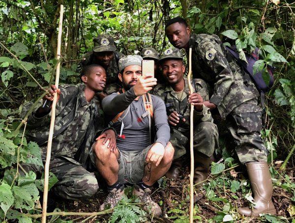 A successful morning sighting skittish chimpanzees in the Cyamudongo Forest near Nyungwe National Park warrants a congratulatory selfie with the skilled trackers. (Giannella M. Garrett)