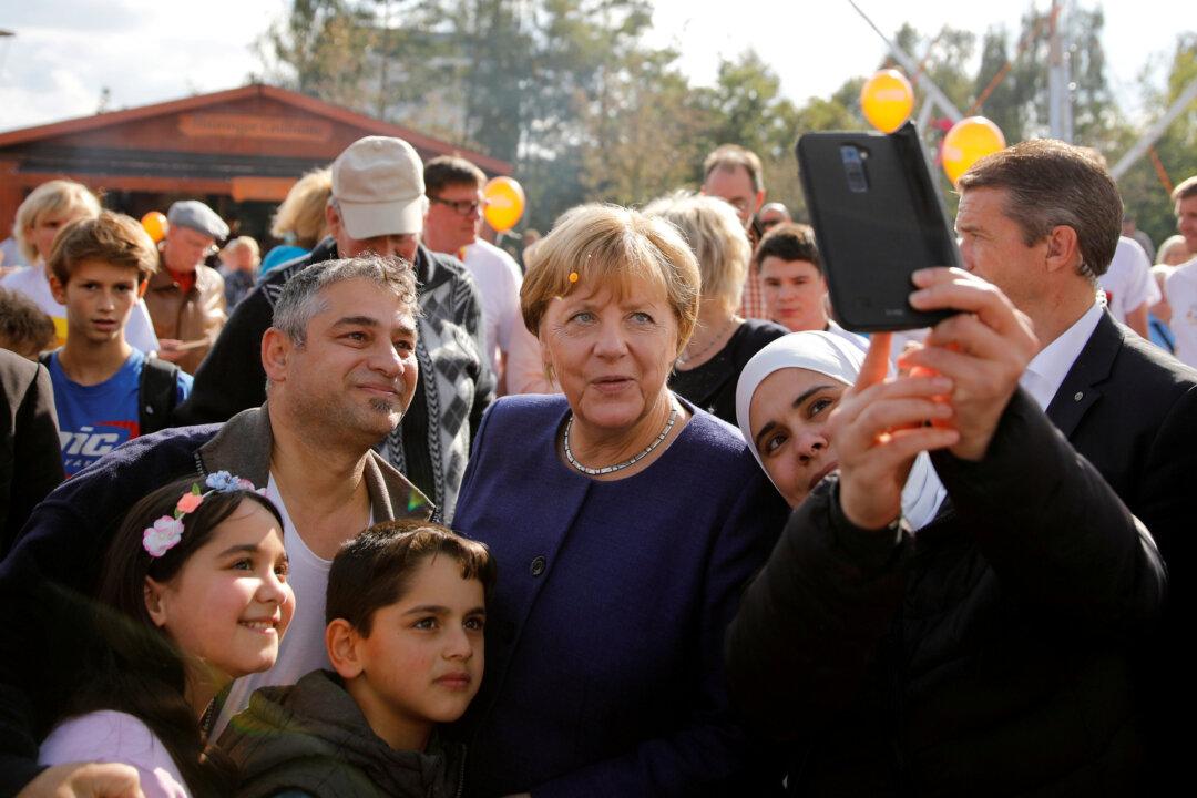 German Chancellor Merkel Takes Gamble With New Immigration Law