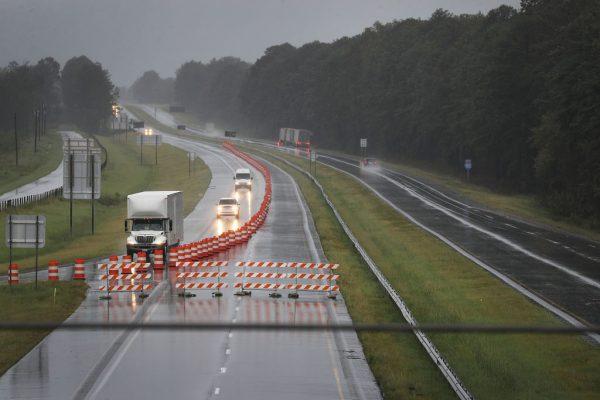 Traffic takes exit 65 from northbound I-95 after it was closed due to floodwaters crossing the highway from Hurricane Florence passing through the area on Sept. 15, 2018, in Godwin, N.C. (Joe Raedle/Getty Images)