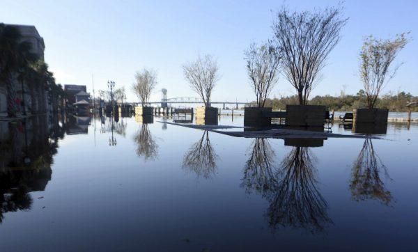 Floodwaters from the Cape Fear River cover Water Street in downtown Wilmington, N.C., Sept. 23, 2018. (Matt Born/The Star-News via AP)