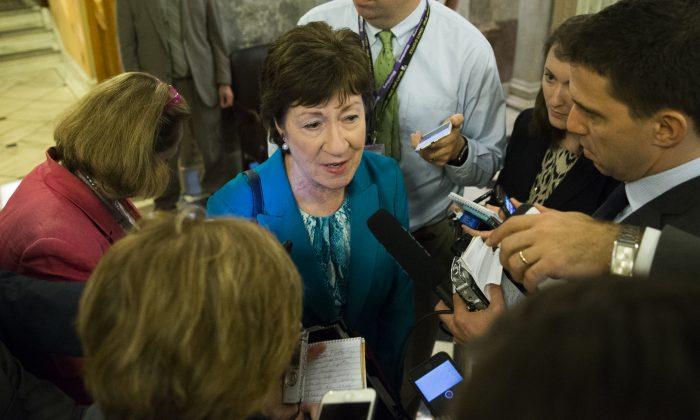 Sen. Susan Collins, R-Maine speaks to reporters on Capitol Hill in Washington, Thursday, June 23, 2016. (AP Photo/Evan Vucci)