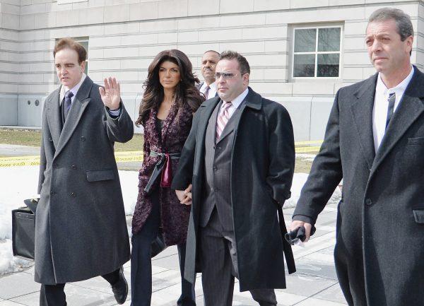 Teresa Giudice (L) and Joe Giudice leave court after facing charges of defrauding lenders, illegally obtaining mortgages and other loans as well as allegedly hiding assets and income during a bankruptcy case on March 4, 2014 in Newark, United States. (Mike Coppola/Getty Images)