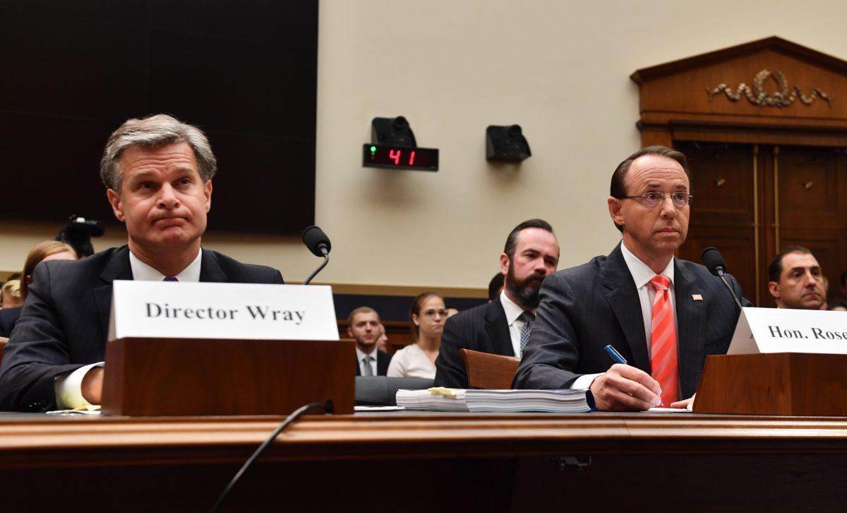 FBI Director Christopher Wray (L) and Deputy Attorney General Rod Rosenstein arrive to testify before a congressional House Judiciary Committee hearing on 'Oversight of FBI and DOJ Actions Surrounding the 2016 Election,' in Washington on June 28, 2018. (NICHOLAS KAMM/AFP/Getty Images)