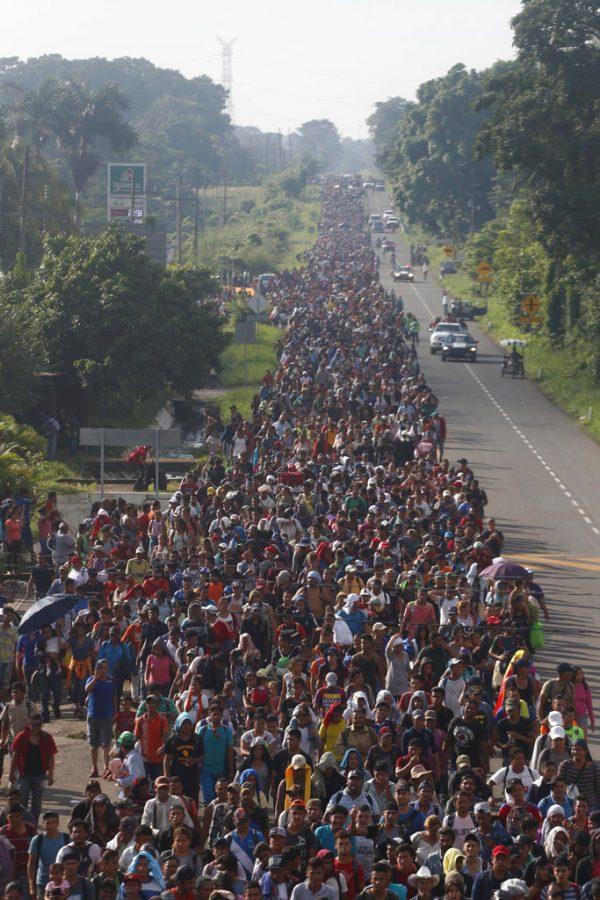 Central American migrants walking to the United States start their day departing Ciudad Hidalgo, Mexico, Oct. 21, 2018. (Moises Castillo/AP Photo)