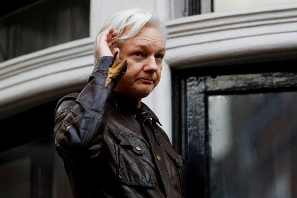 WikiLeaks founder Julian Assange is seen on the balcony of the Ecuadorian Embassy in London, on May 19, 2017. (Peter Nicholls/Reuters)