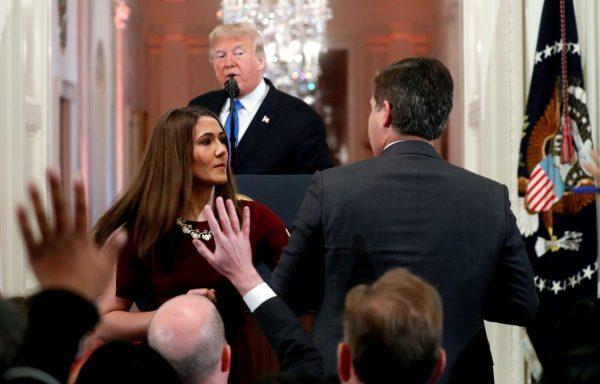 A White House staff member steps in to try to take the microphone away from CNN’s Jim Acosta as he questions U.S. President Donald Trump during a news conference at the White House in Washington on Nov. 7, 2018. (Kevin Lamarque/Reuters)