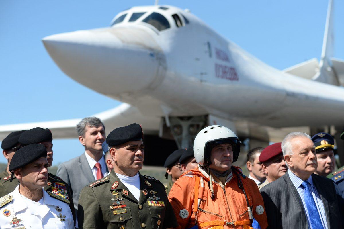 Venezuelan Defence Minister Vladimir Padrino (2nd L) is pictured after the arrival of two Russian Tupolev Tu-160 strategic long-range heavy supersonic bomber aircrafts at Maiquetia International Airport, just north of Caracas, on Dec. 10, 2018. (Federico Parra/AFP/Getty Images)