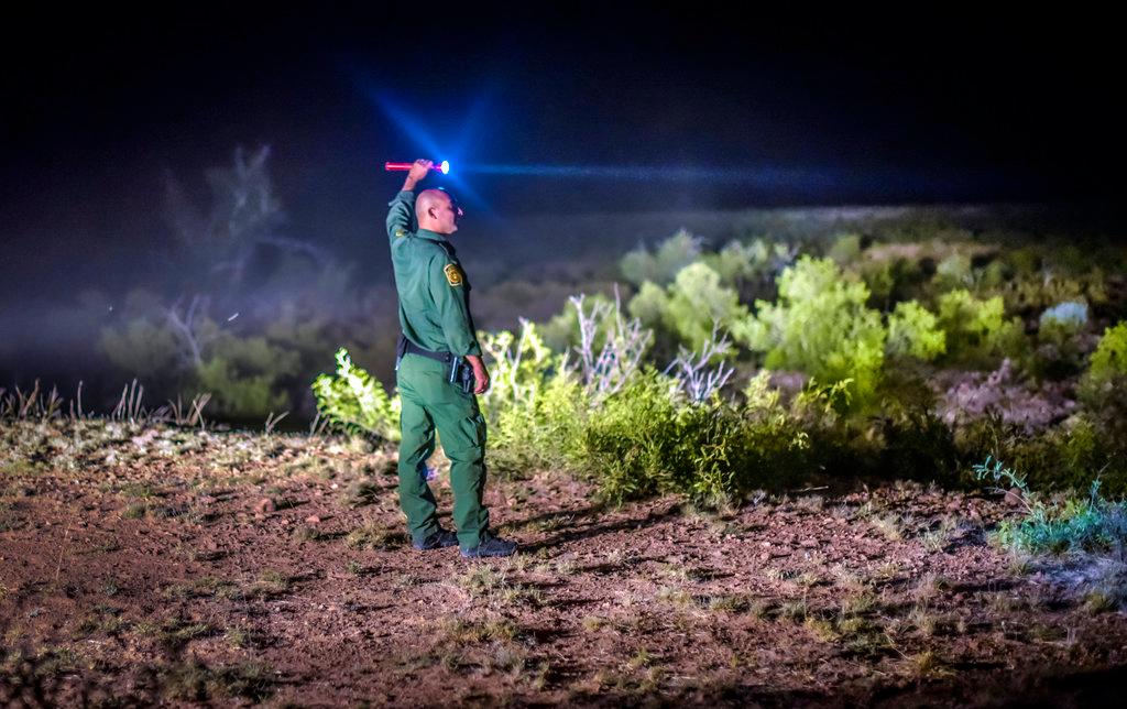 In this June 23, 2015, file photo, Border Patrol agents wait for other units in the Animas Valley in New Mexico's boot heel area. (Roberto E. Rosales/The Albuquerque Journal via AP, File)