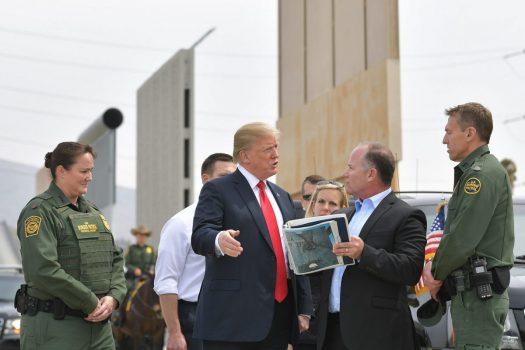 President Donald Trump (C) is shown border wall prototypes in San Diego, California on March 13, 2018. (Mandel Ngan/AFP/Getty Images)