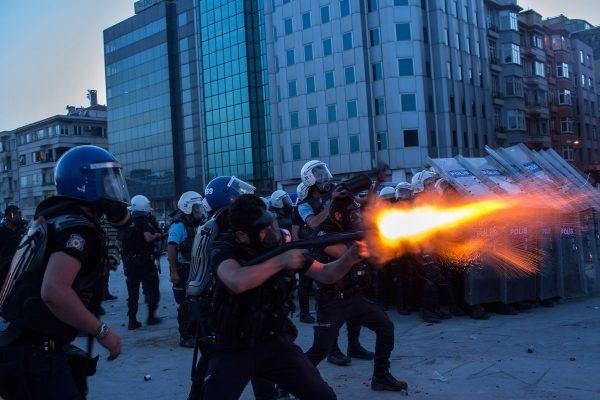 Riot police fire tear gas to disperse the crowd during a demonstration near Taksim Square on June 11, 2013, in Istanbul. (Lam Yik Fei/Getty Images)