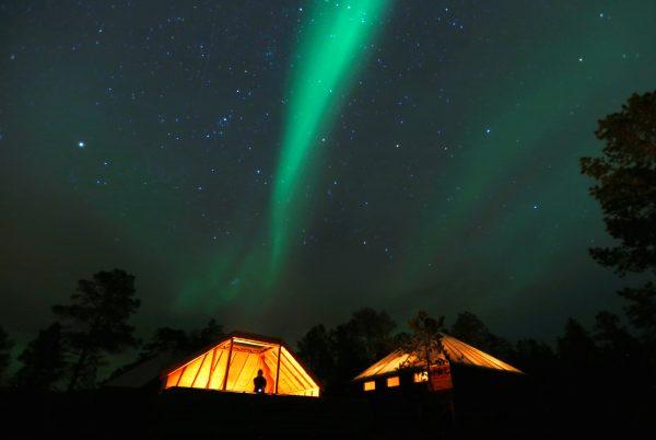 The Aurora Borealis (Northern Lights) is seen over a mountain camp north of the Arctic Circle, near the village of Mestervik on Oct. 1, 2014. (Reuters/Yannis Behrakis)