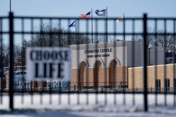 Flags fly over the Covington Catholic High School stadium in Park Kills, Ky., on Jan 20, 2019. (Bryan Woolston/AP Photo)