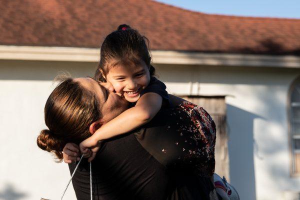 Martina Arredondo hugs her granddaughter at her home in Rio Grande City, Texas, on Nov. 6, 2018. (Samira Bouaou/The Epoch Times)