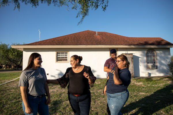 Martina Arredondo (C) at her home with two of her daughters and extended family members in Rio Grande City, Texas, on Nov. 6, 2018. (Samira Bouaou/The Epoch Times)
