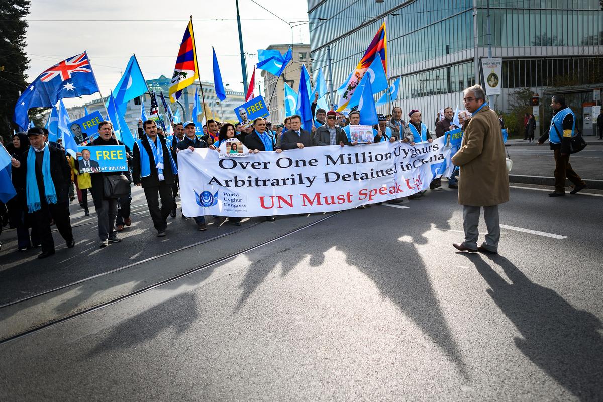 Uyghurs and Tibetans demonstrate against China outside of the United Nations (UN) offices during the Universal Periodic Review of China by the UN Human Rights Council in Geneva on Nov. 6, 2018. (Fabrice Coffrini/AFP/Getty Images)