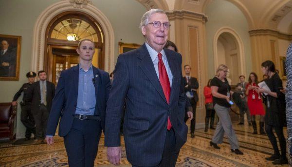 Senate Majority Leader Mitch McConnell, R-Ky., leaves the chamber after Senate Democrats blocked President Donald Trump's request for $5.7 billion to construct his long-sought wall along the U.S-Mexico border, as a partial government shutdown continues, at the Capitol in Washington, Jan. 24, 2019. (AP Photo/J. Scott Applewhite)