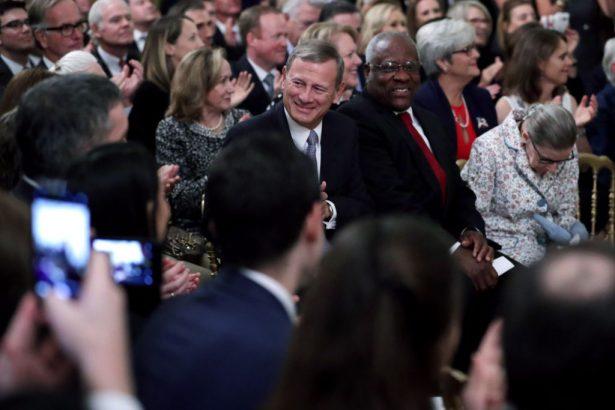 L-R) Supreme Court Chief Justice John Roberts, Associate Justices Clarence Thomas, and Ruth Bader Ginsburg attend the ceremonial swearing-in of Associate Justice Brett Kavanaugh in the East Room of the White House in Washington on Oct. 8, 2018. (Chip Somodevilla/Getty Images)
