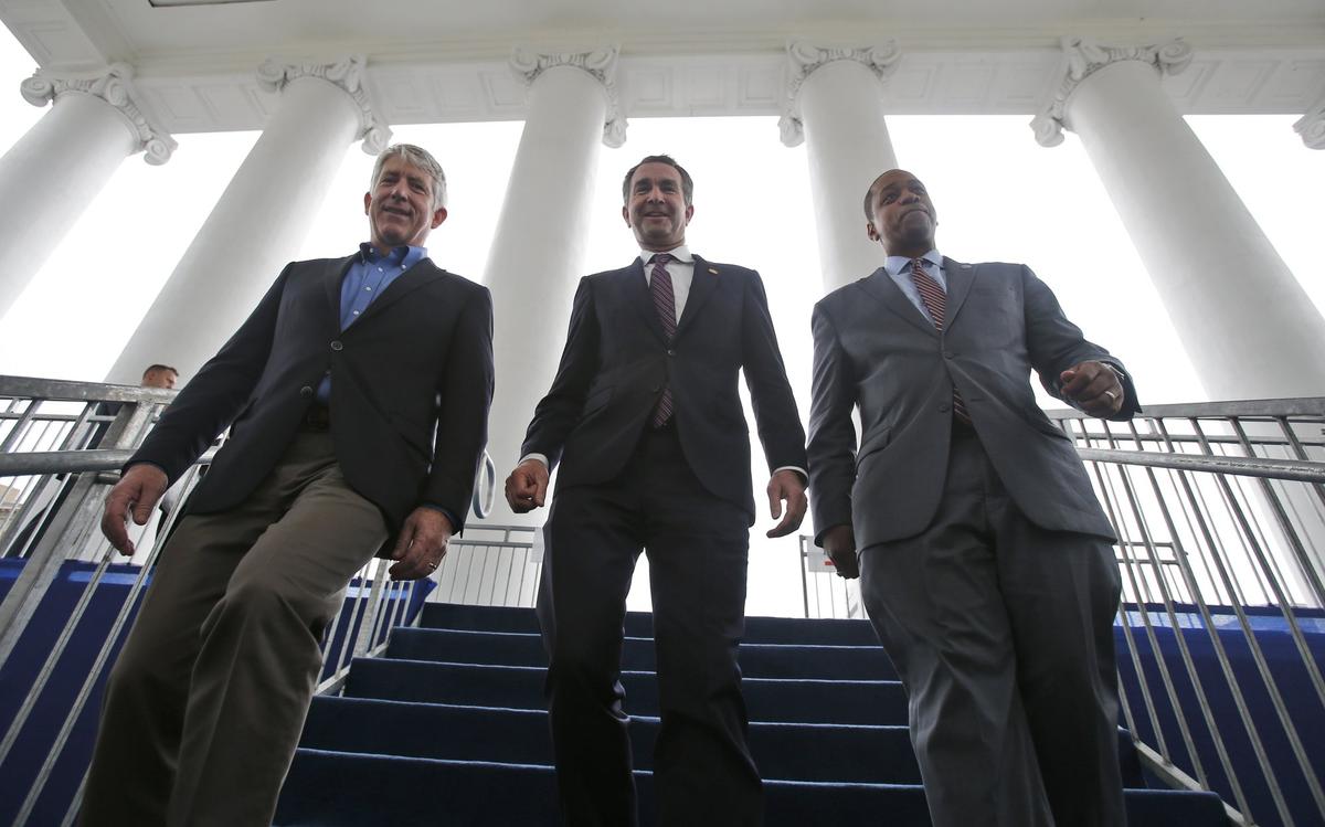 Virginia Gov.-elect, Lt. Gov Ralph Northam, center, walks down the reviewing stand with Lt. Gov-elect, Justin Fairfax, right, and Attorney General Mark Herring at the Capitol in Richmond, Va. on Jan. 12, 2018 (Steve Helber/AP)